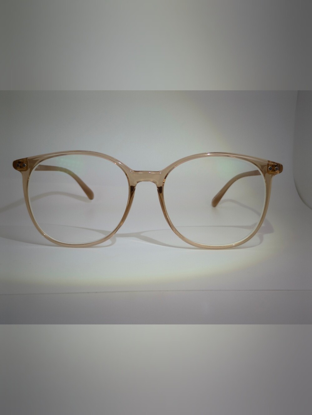 Lucia. Clear Nude Round Frame Glasses. Minimalist Metal.